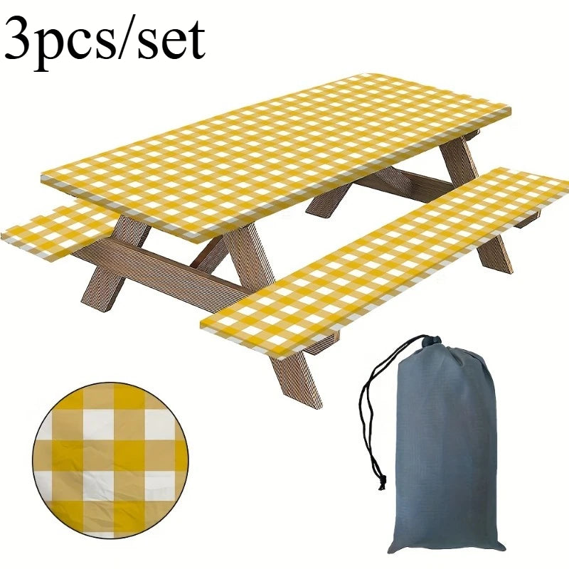 A set of three yellow and white plaid picnic mats or tablecloths for outdoor use.