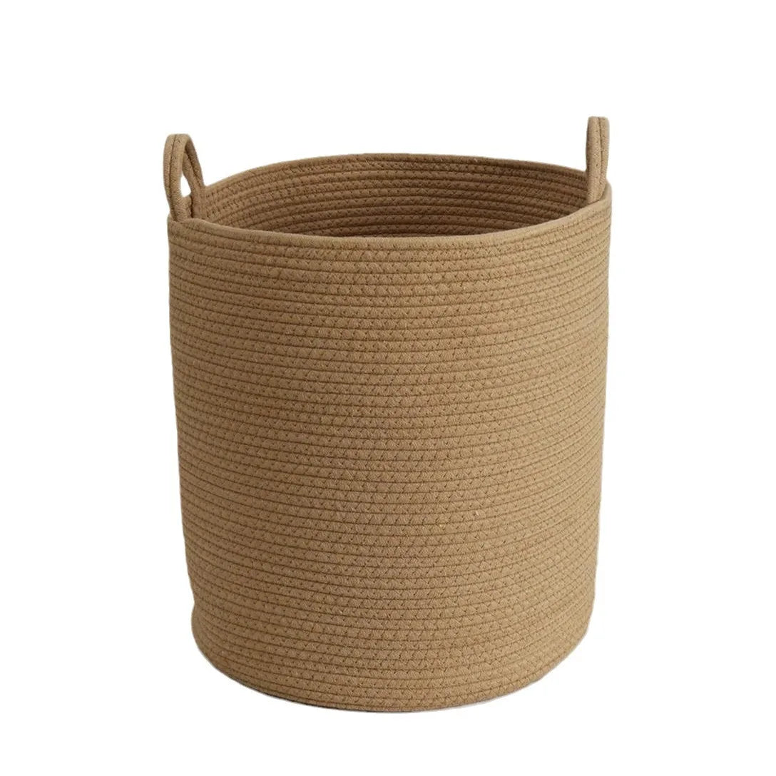 A natural beige cotton rope storage basket with a ribbed texture.