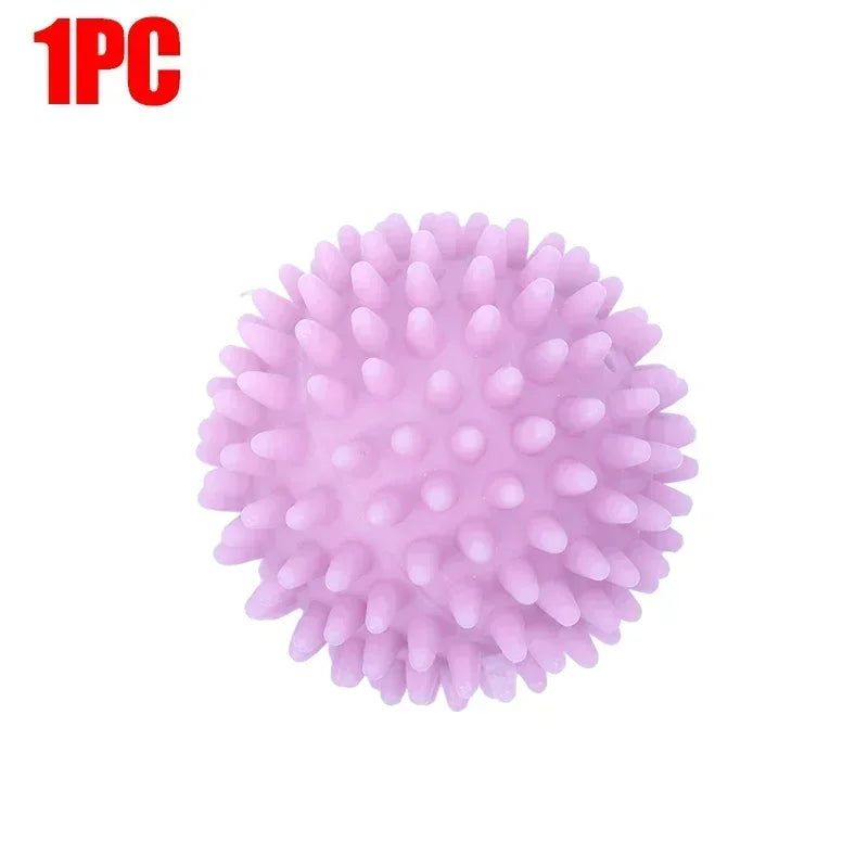 A single pink reusable silicone laundry ball.
