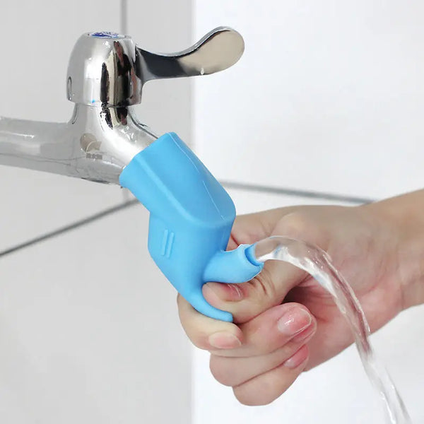 A hand is using a blue silicone tap extender to control water flow from a kitchen faucet.