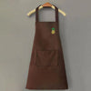 A dark brown chef apron hanging on a wooden hanger with a small yellow pineapple embroidered on the chest.