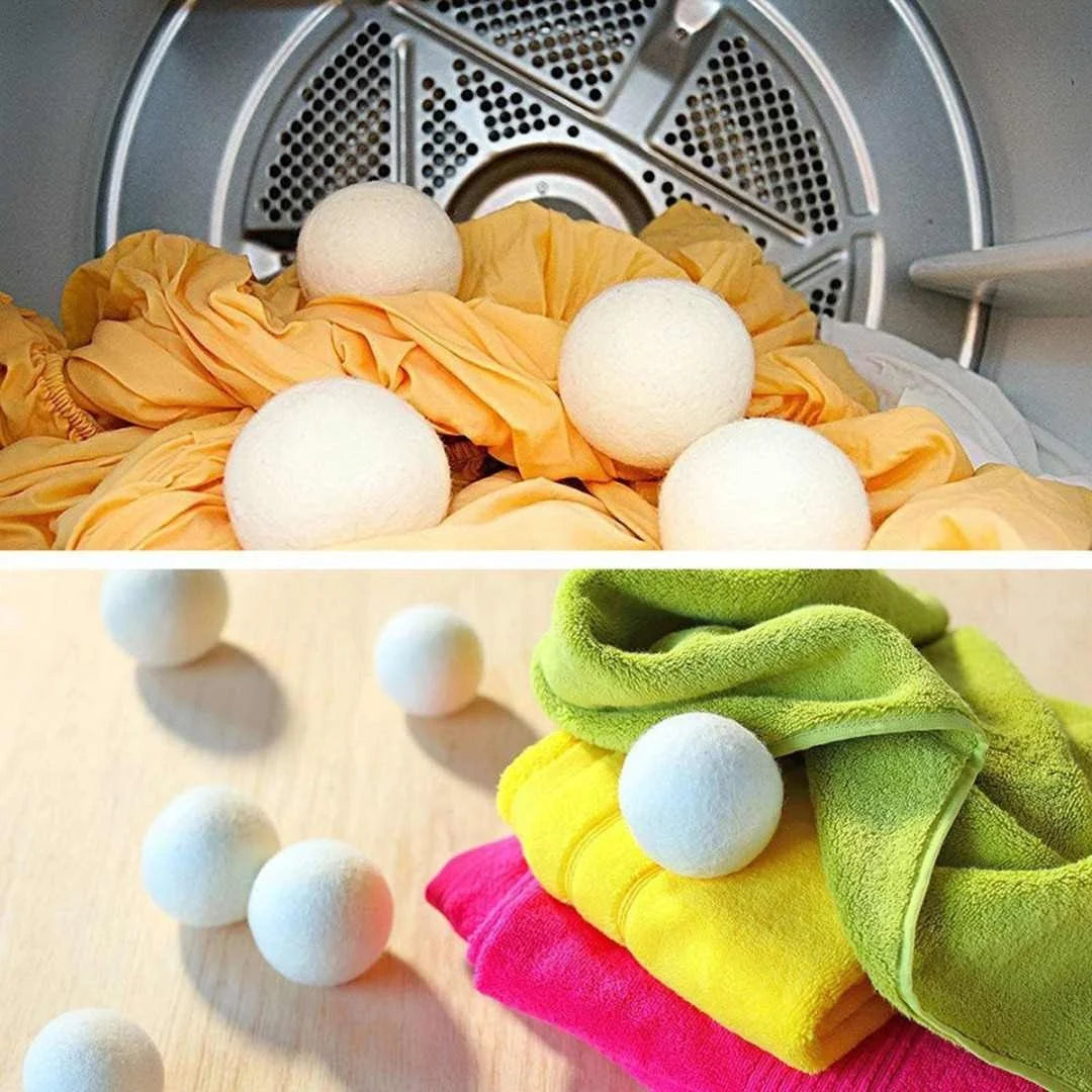 A collection of reusable wool dryer balls in white, yellow, and green colors.