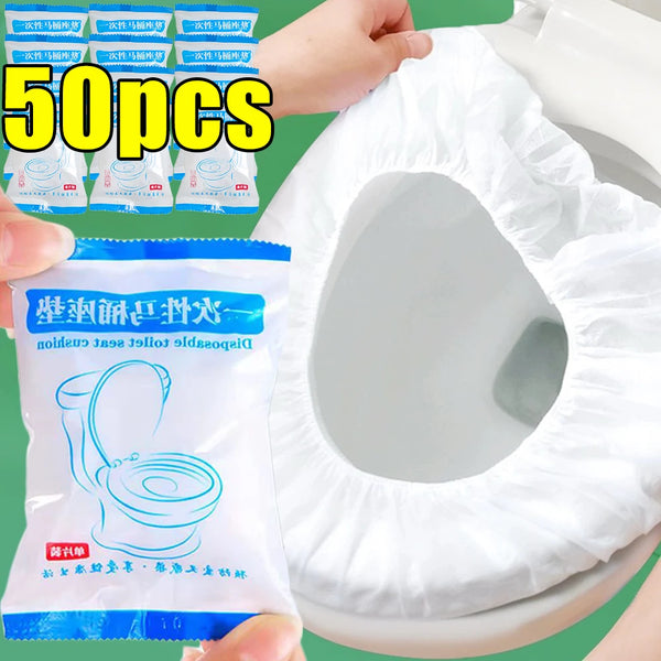 A package of 50 pieces of waterproof disposable toilet seat covers next to a white toilet bowl.
