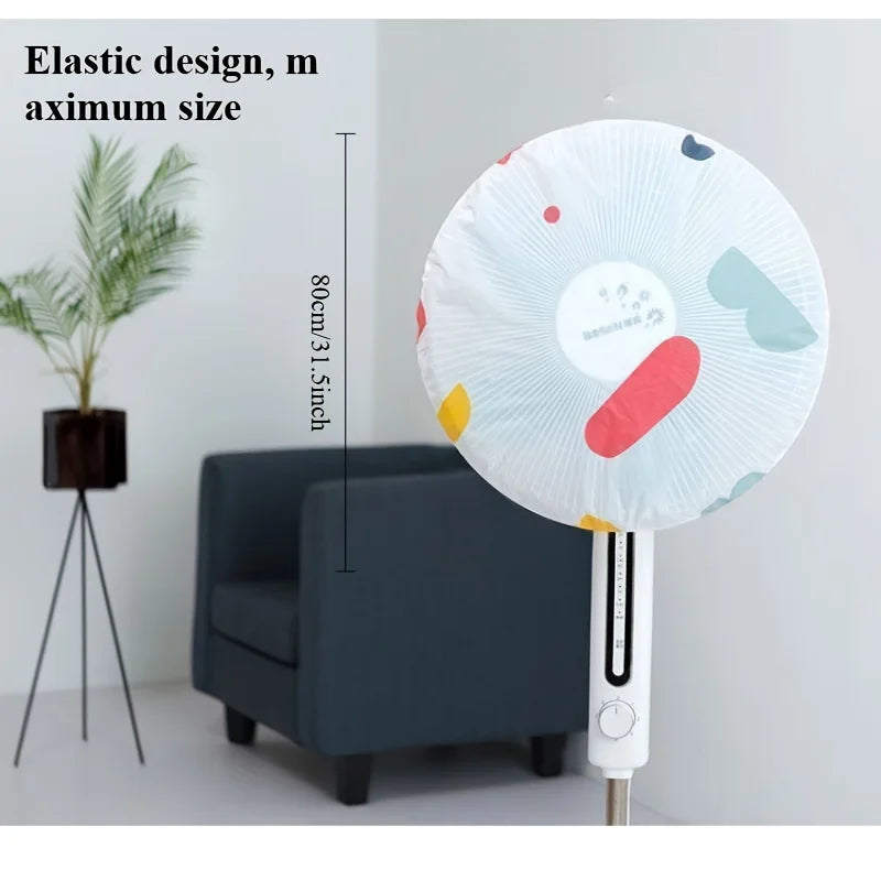 A white electric fan with an elastic design and a protective cover, shown next to a piece of furniture.