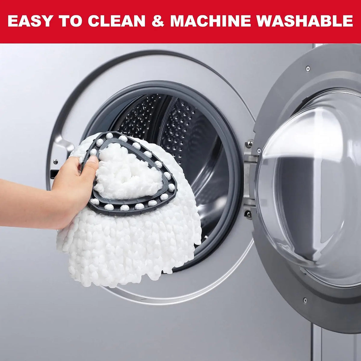 A hand is placing a white microfiber spin mop refill head into the drum of a washing machine.