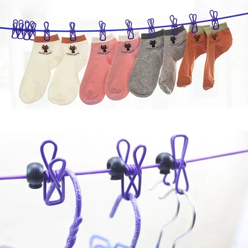 A line of assorted colored socks hanging on an adjustable elastic clothesline for outdoor drying.