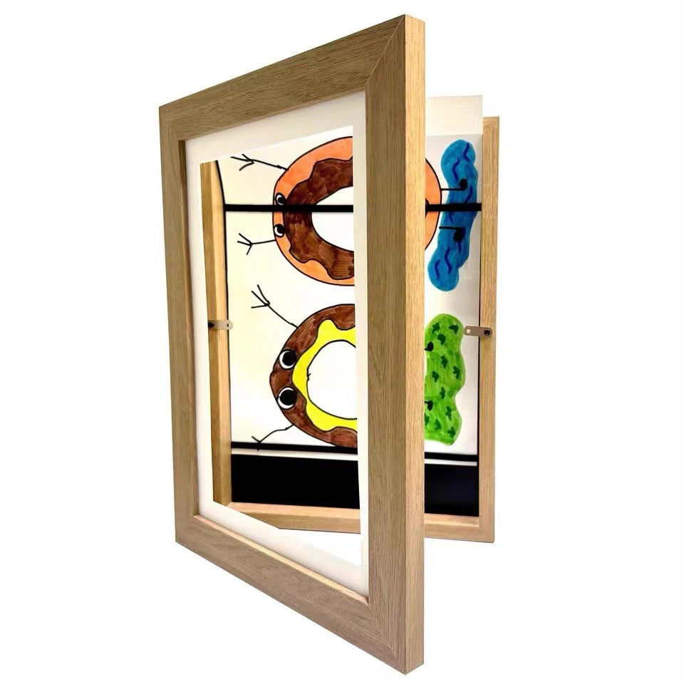 A wooden frame displaying various magnetic art pieces, including shapes and colors.