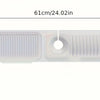 A white silicone kitchen sink splash guard with two slotted openings for draining.