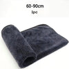 A rolled microfiber car cleaning towel in dark gray or black color.