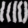 A set of disposable transparent shower caps arranged in a vertical line.
