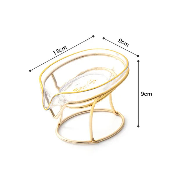 A gold-colored decorative leaf soap dish with a clear glass insert shown with dimensions.