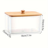 Clear glass container with a bamboo lid for storing dryer sheets.