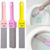 Three natural pumice toilet cleaning brushes in pink, purple, and yellow with handles.