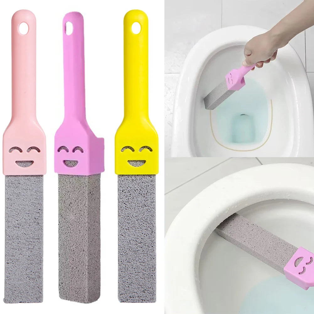 Three natural pumice toilet cleaning brushes in pink, purple, and yellow with handles.