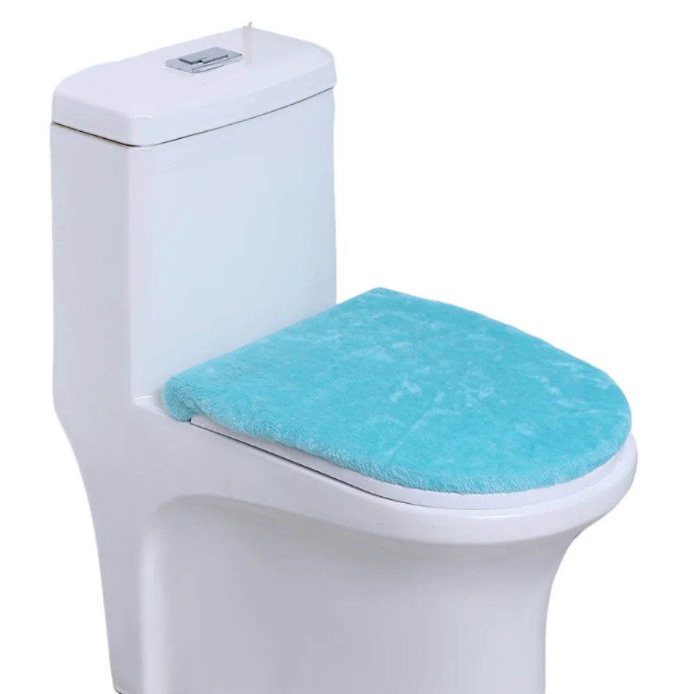 A white toilet with a light blue protective seat cover installed.