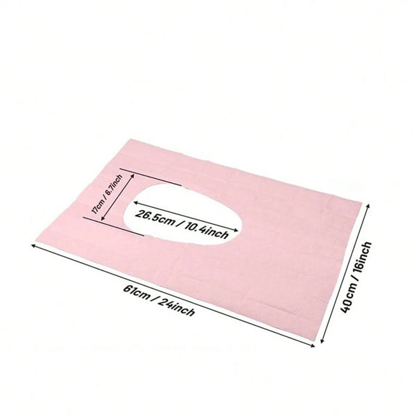 Pink disposable toilet seat covers set showing the dimensions of a single cover.