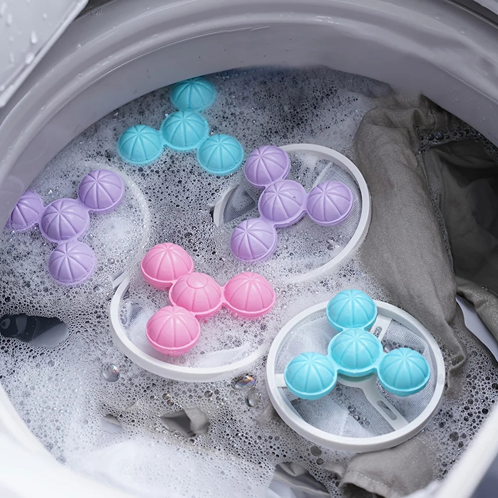 Floating pet hair remover tool with purple and blue silicone spheres floating in soapy water