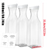 Three clear glass refillable storage bottles for laundry detergent with silicone stoppers and labels