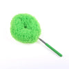 A bright lime green extendable microfiber duster with a black handle and fluffy head.