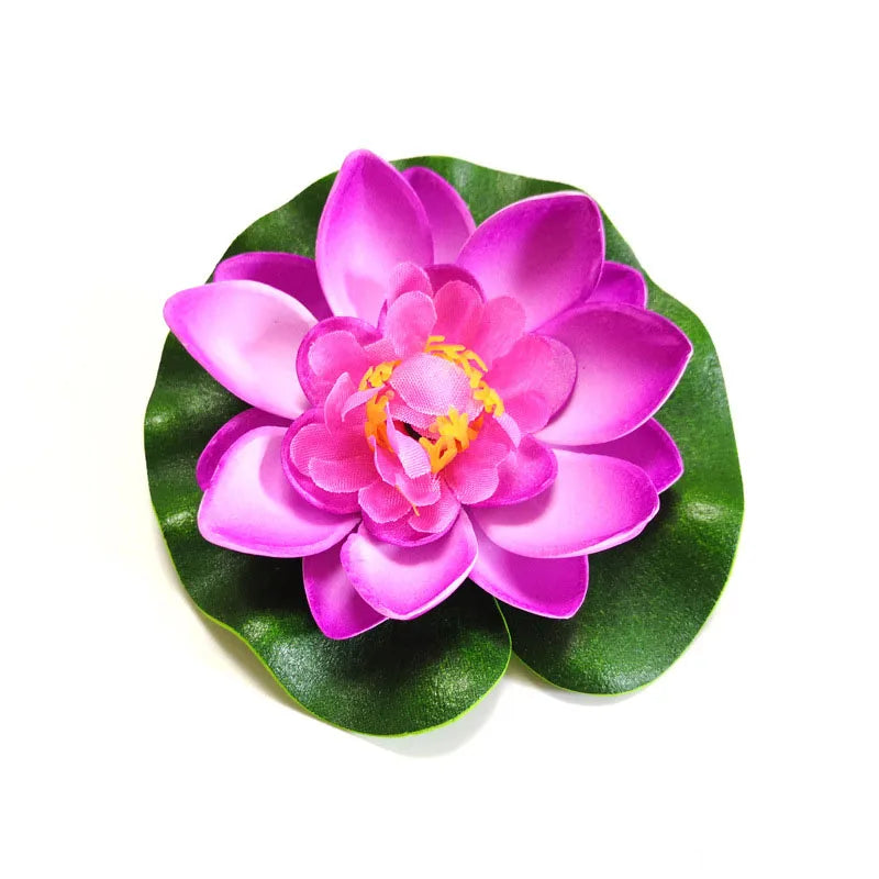 A vibrant pink artificial lotus flower with green leaves.