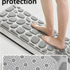 A gray non-slip mat with a pebble embossed pattern is shown being used for reassuring protection on a bathroom surface.