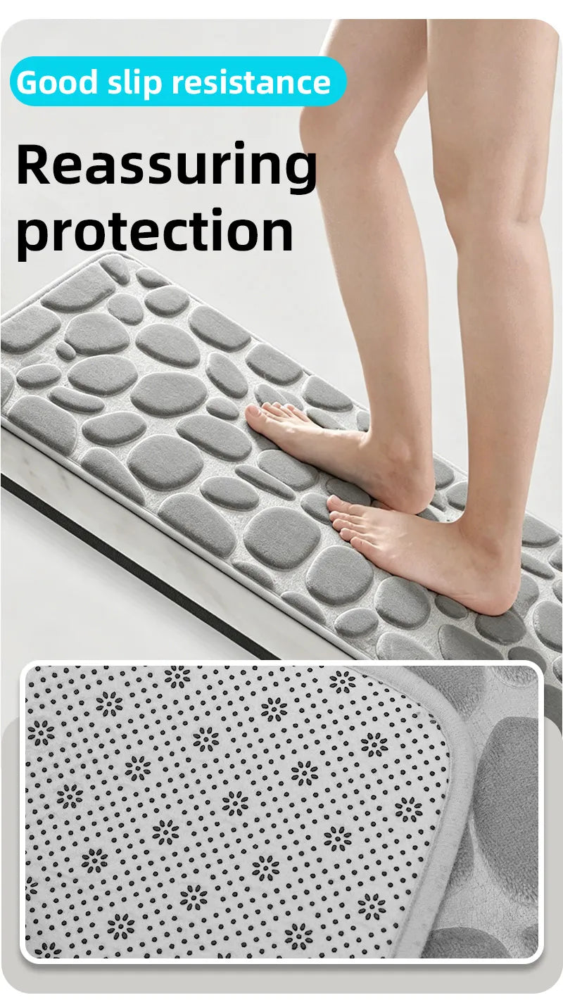A gray non-slip mat with a pebble embossed pattern is shown being used for reassuring protection on a bathroom surface.