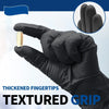 A hand wearing a black glove is shown gripping a small gold object, demonstrating thickened fingertips and textured grip.