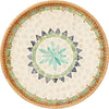Round rattan serving tray with mother of pearl inlay featuring a geometric pattern.