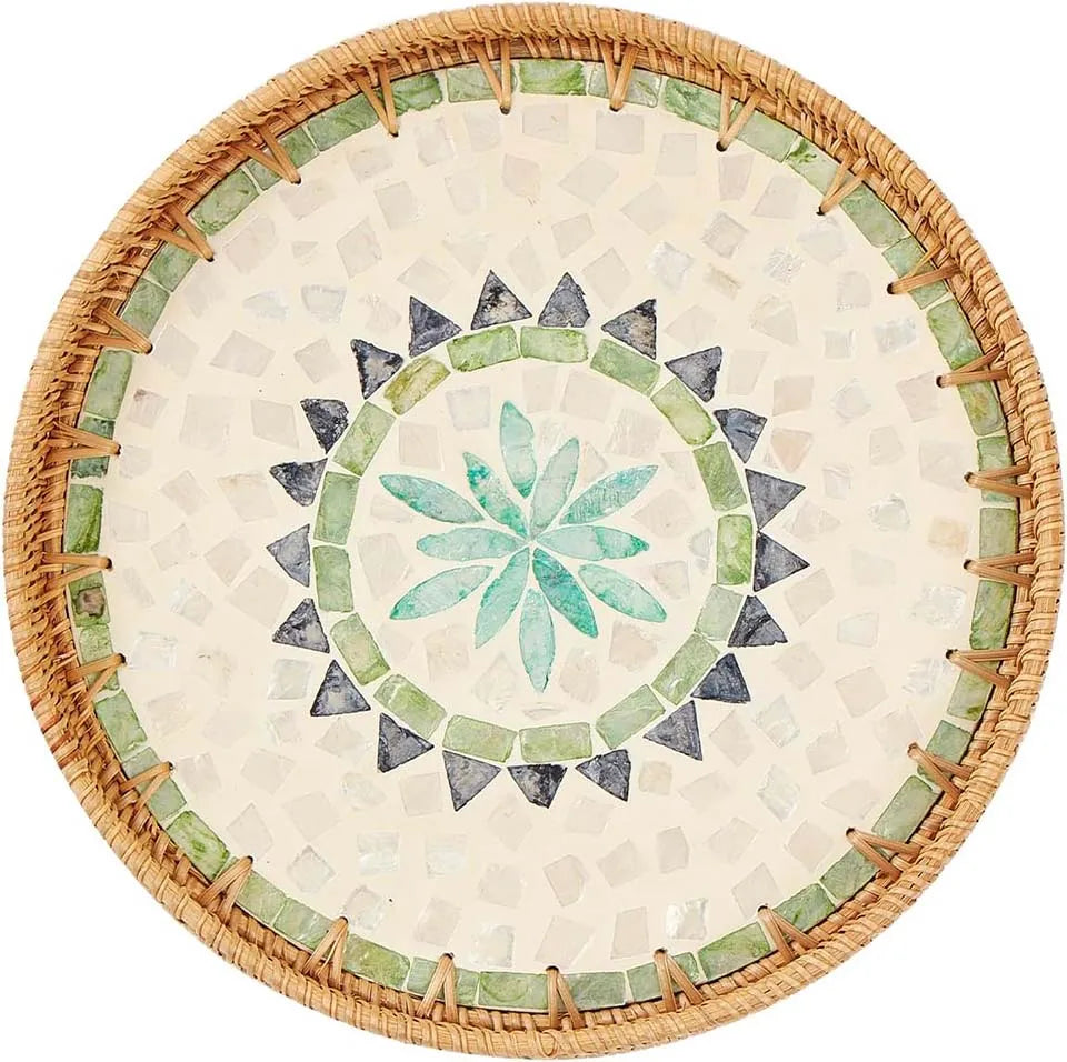 Round rattan serving tray with mother of pearl inlay featuring a geometric pattern.