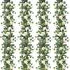 A vertical garland made of artificial eucalyptus leaves and white roses.