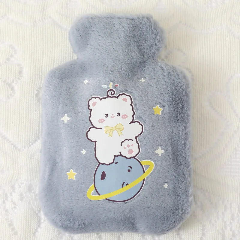 A soft gray plush cartoon bear with a yellow bow is depicted on a hot water bottle.