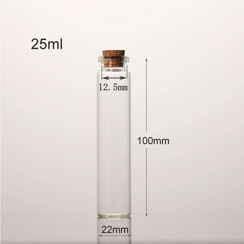 Flacon de potion en verre transparent avec bouchon en liège, étiqueté 25ml et mesurant 100mm de haut.
