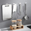 Stainless steel adhesive hooks and a cutting board displayed on a gray wall.