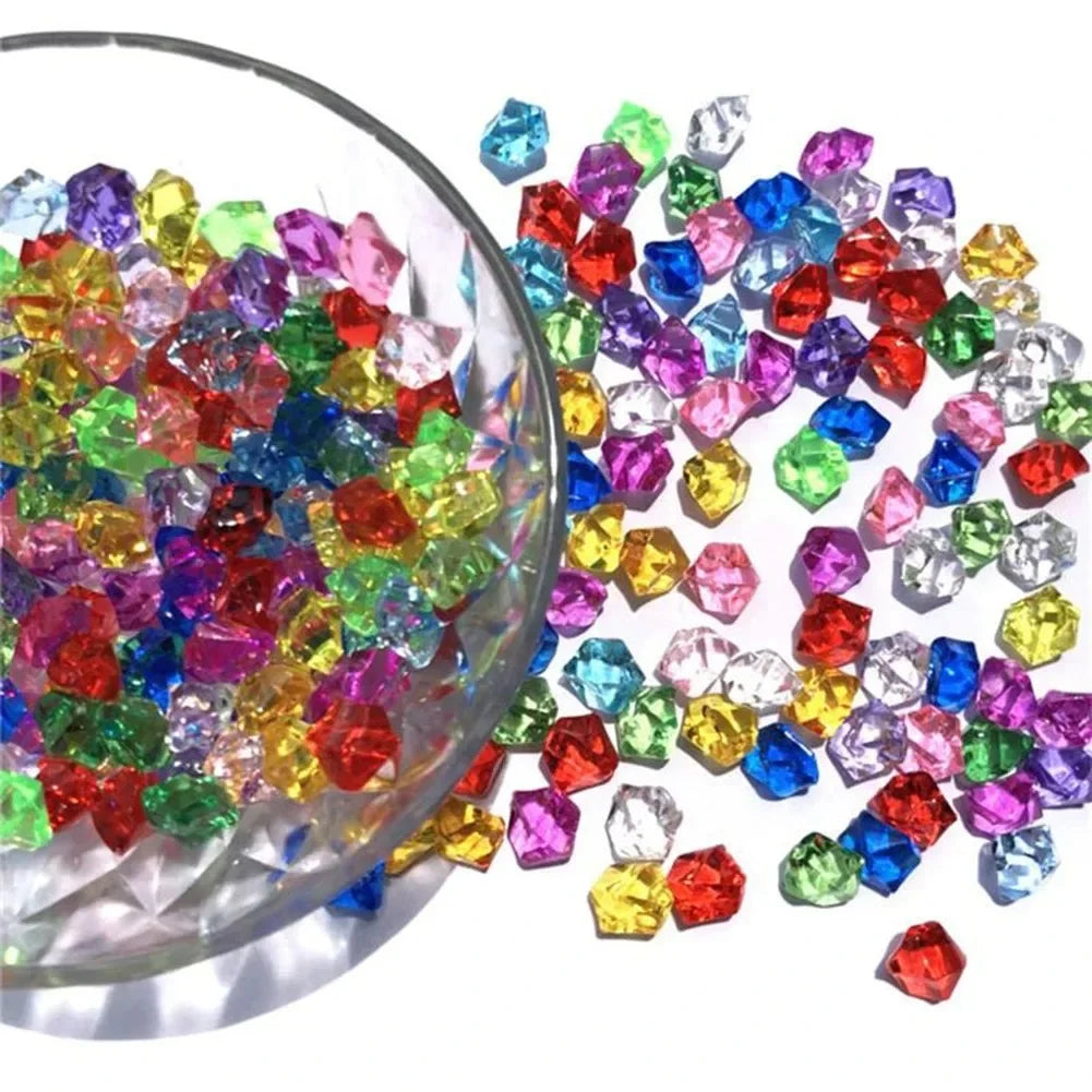 A pile of colorful crystal crushed ice stones in various shades of red, blue, green, and purple.