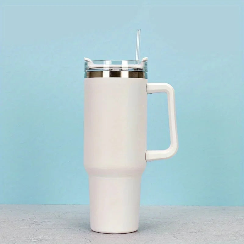 A white 40oz insulated stainless steel tumbler with a handle and straw set against a light blue background.