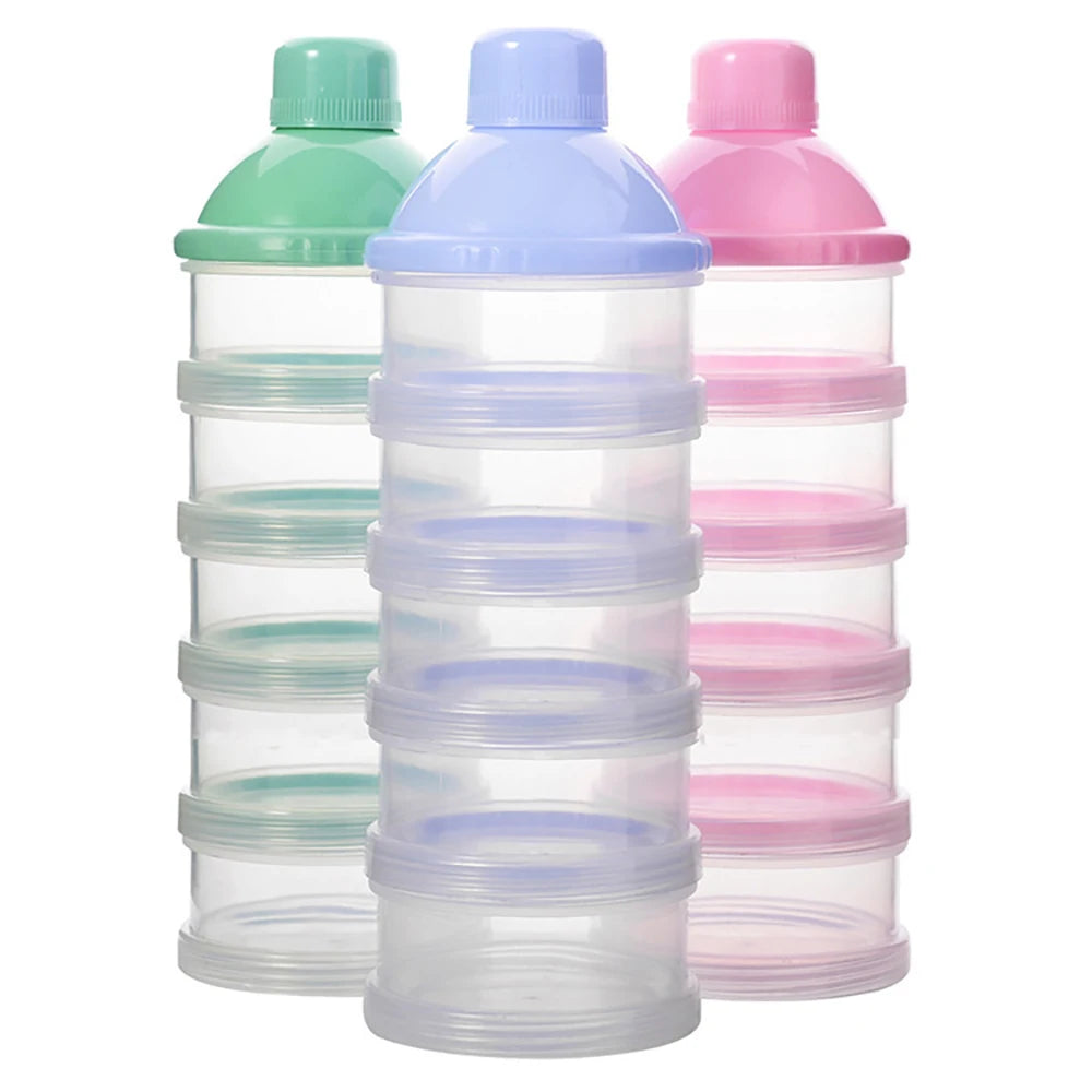 A set of clear plastic portable milk powder storage containers in shades of green, blue, and pink.
