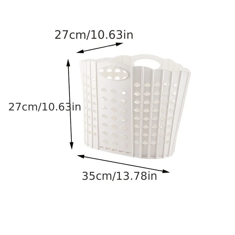 White folding hand-held clothes storage basket with a perforated design.