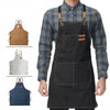 A dark gray plaid shirt worn by a person, featuring an olive green canvas apron with utility pockets.