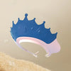 A blue adjustable baby bath shampoo shield cap is shown against a light background.
