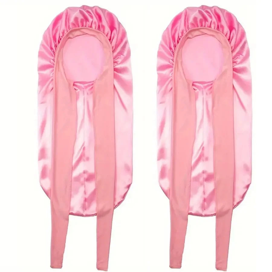 Pink satin sleep bonnet designed for curly hair