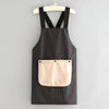 Black and white striped waterproof sleeveless kitchen apron with a removable beige hand towel