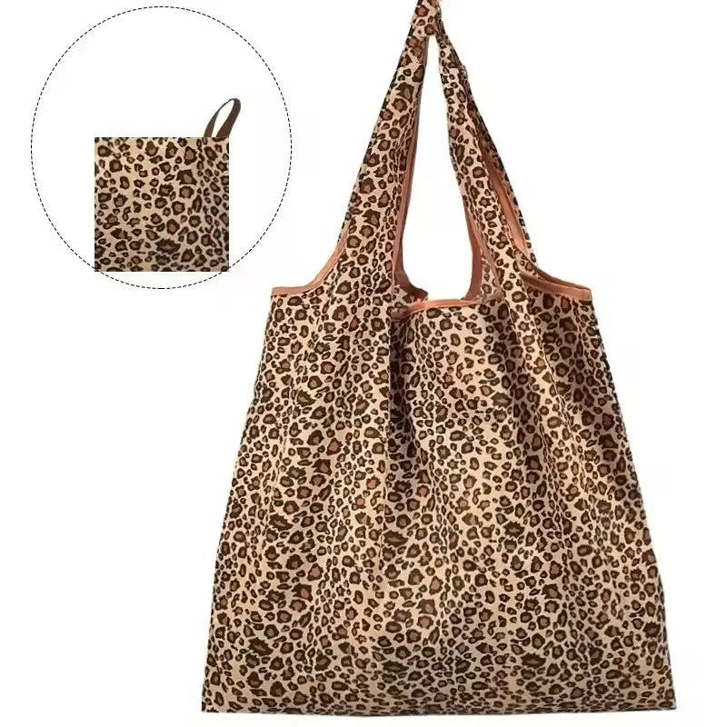 A brown leopard print foldable tote bag with a natural tan handle.