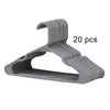 A set of 20 gray plastic clothes hangers with curved hooks.