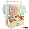A natural wood storage crate organizer holding baby clothes and stuffed animals.