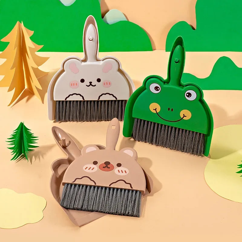 A set of cartoon animal brooms and dustpans featuring woodland creatures like a bear and a rabbit.