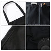 Classic black chef apron featuring a large front pocket and textured fabric details.
