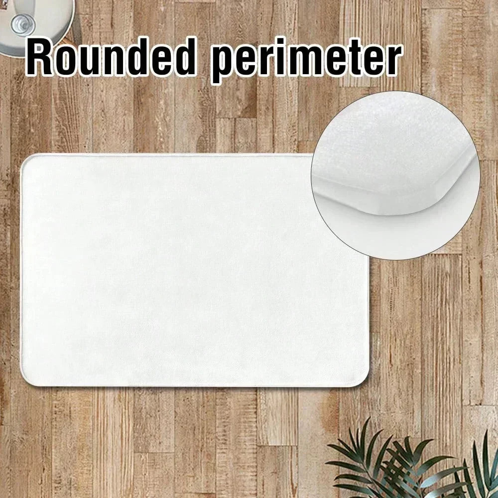 White botanical leaf carpet mat with a rounded perimeter placed on a wooden surface.