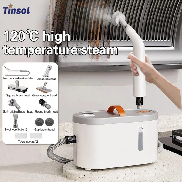 A hand is using a white handheld electric steam cleaner to apply high-temperature steam to a grill.