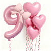 Un set de seis globos de aluminio con forma de corazón rosa que forman el número 9, atados con una cinta rosa.