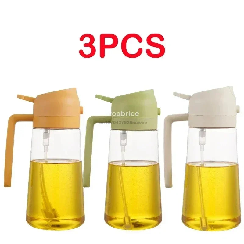 Three clear glass oil spray bottles with light yellow oil and white/green pump tops.